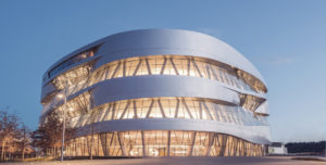 A modern building over a blue sky.