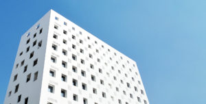 A modern building over a blue sky.