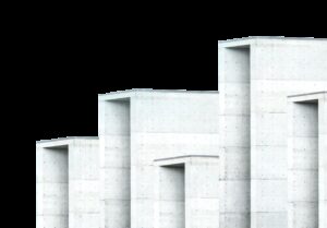 Abstract view of a series of white, rectangular architectural structures against a pale blue sky.