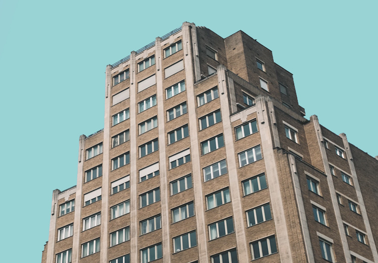 A heritage building over a blue sky.